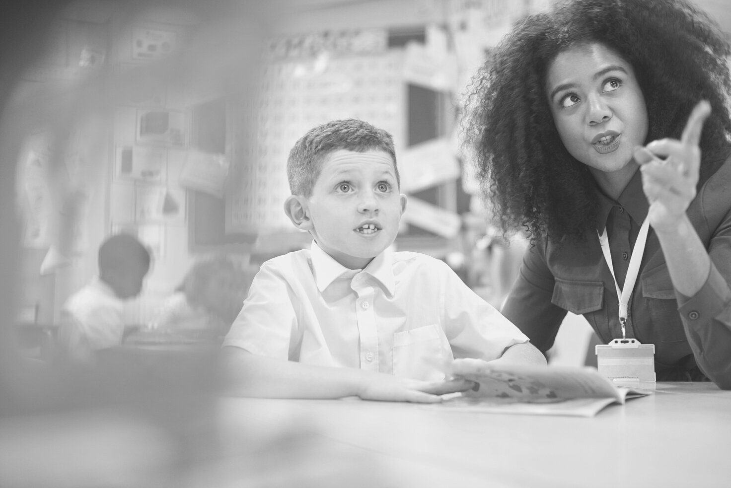 teacher and pupil working hard